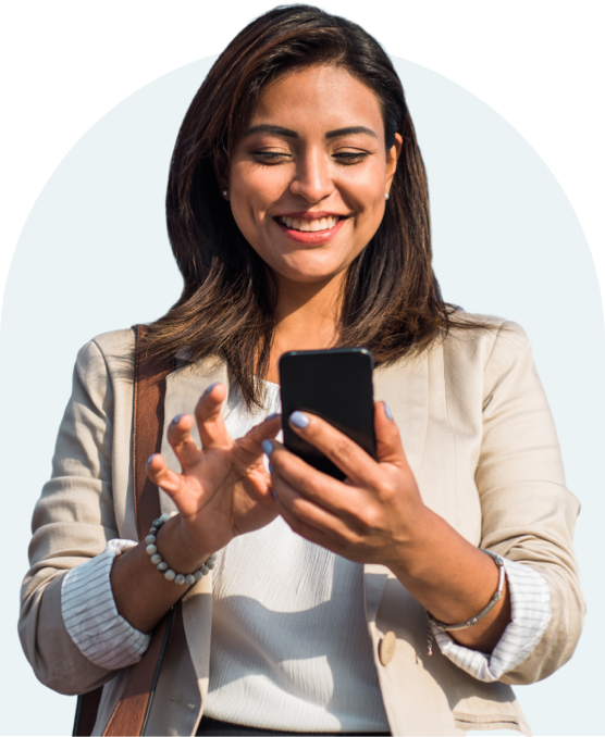 Woman smiling while using mobile phone