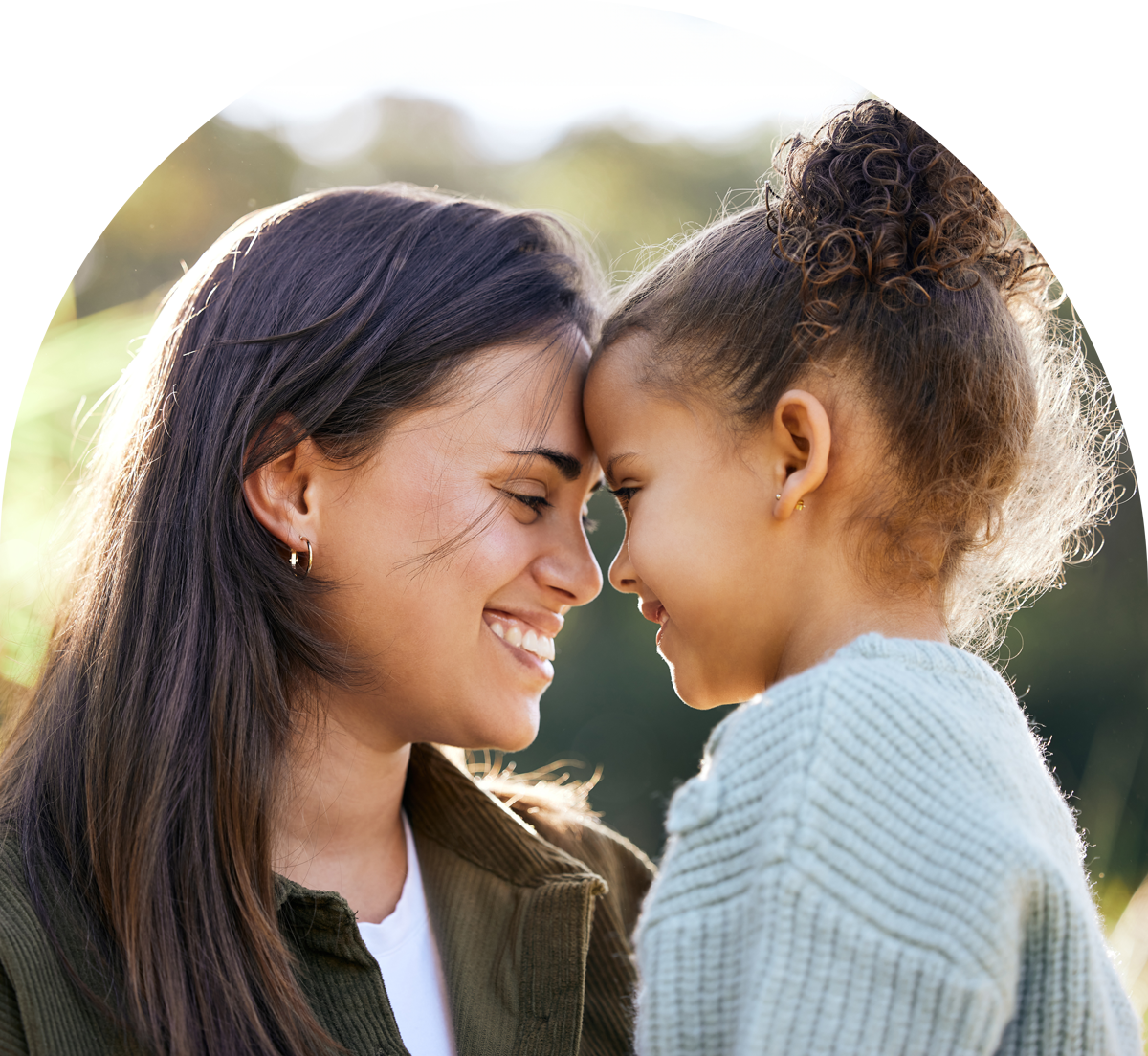 Mother and child touching foreheads and smiling